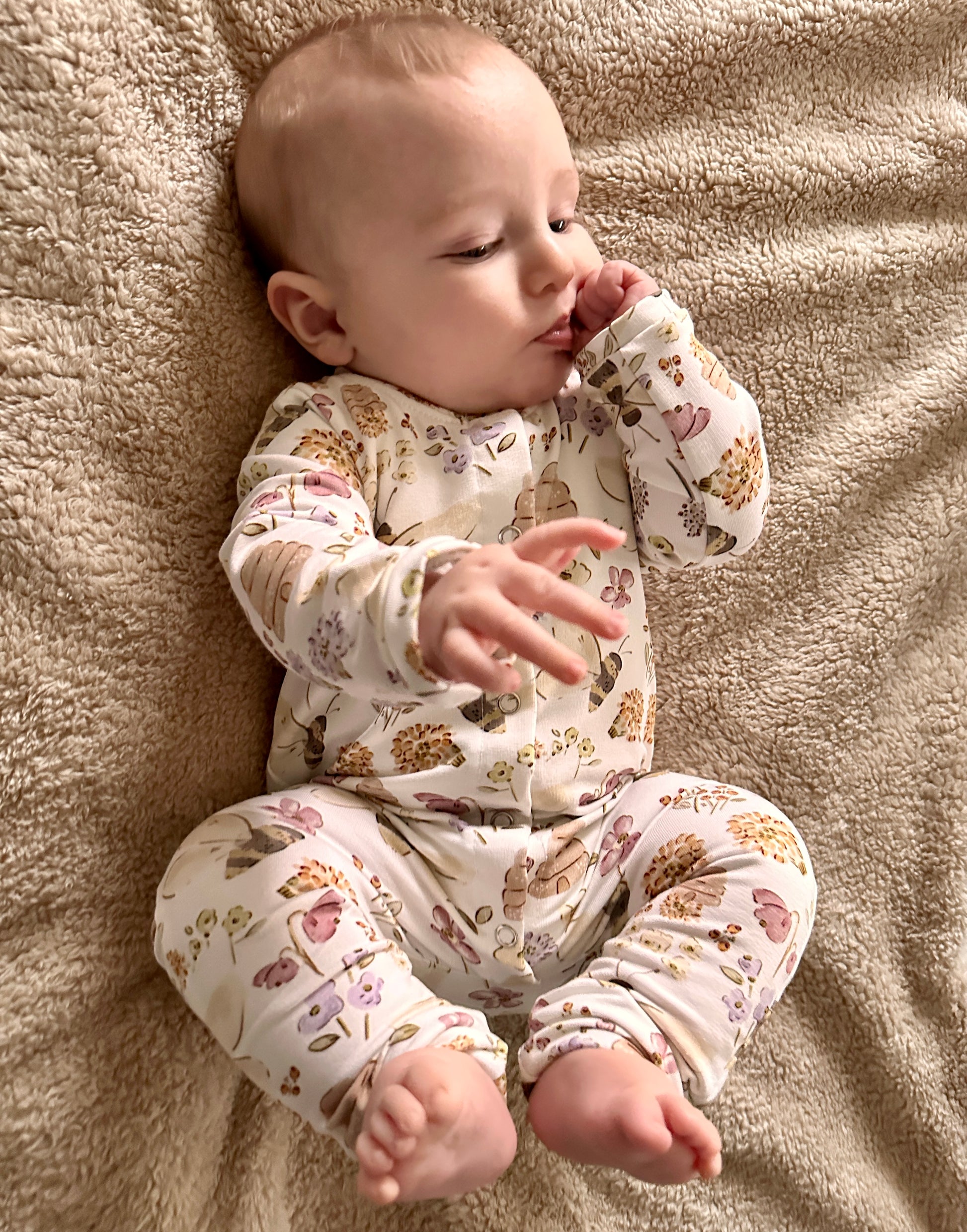 Front opening romper with bees and flowers