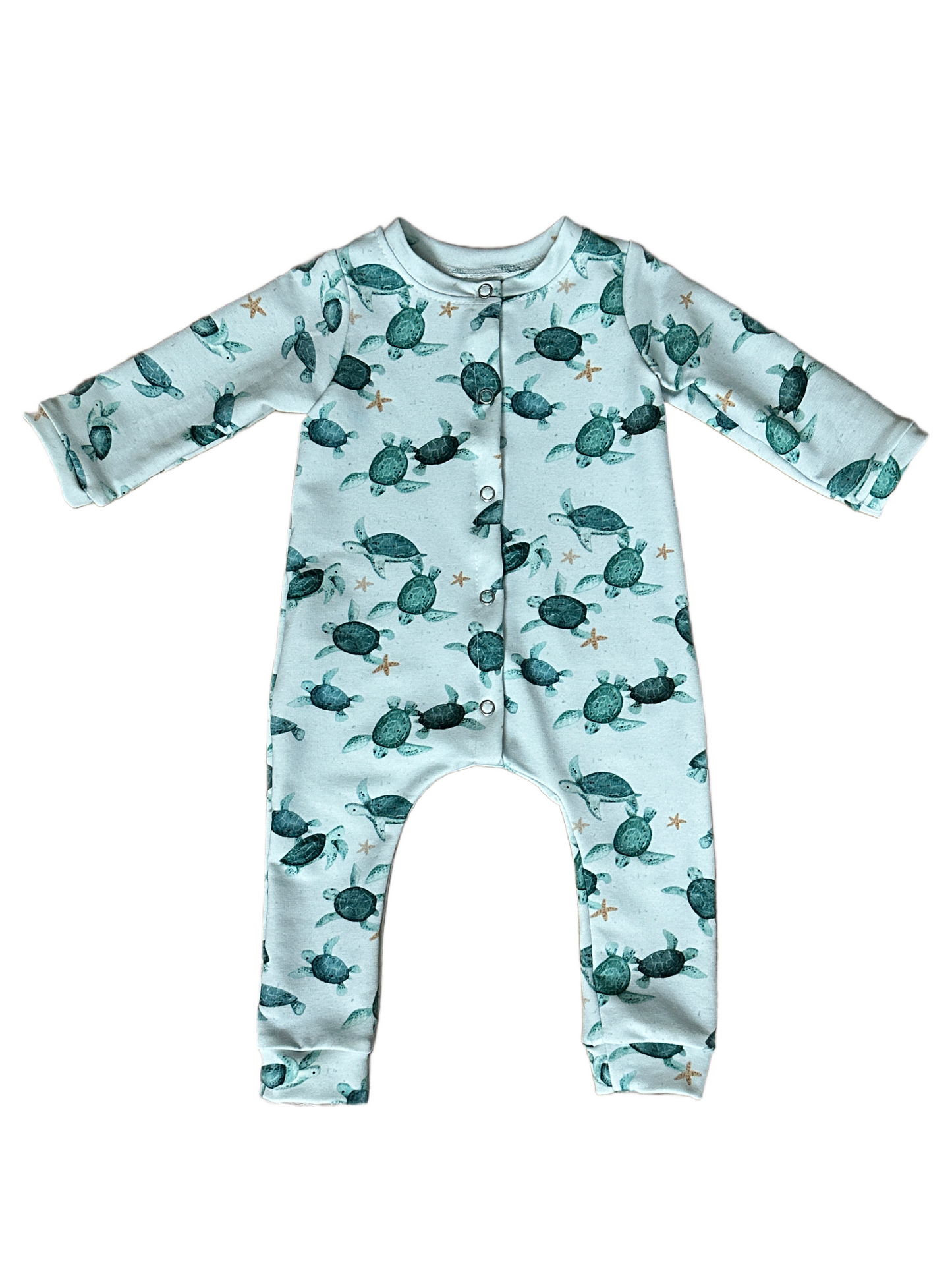 Baby onesie with turtle pattern on a white background
