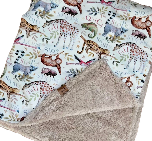 Fleece baby blanket featuring an animal pattern