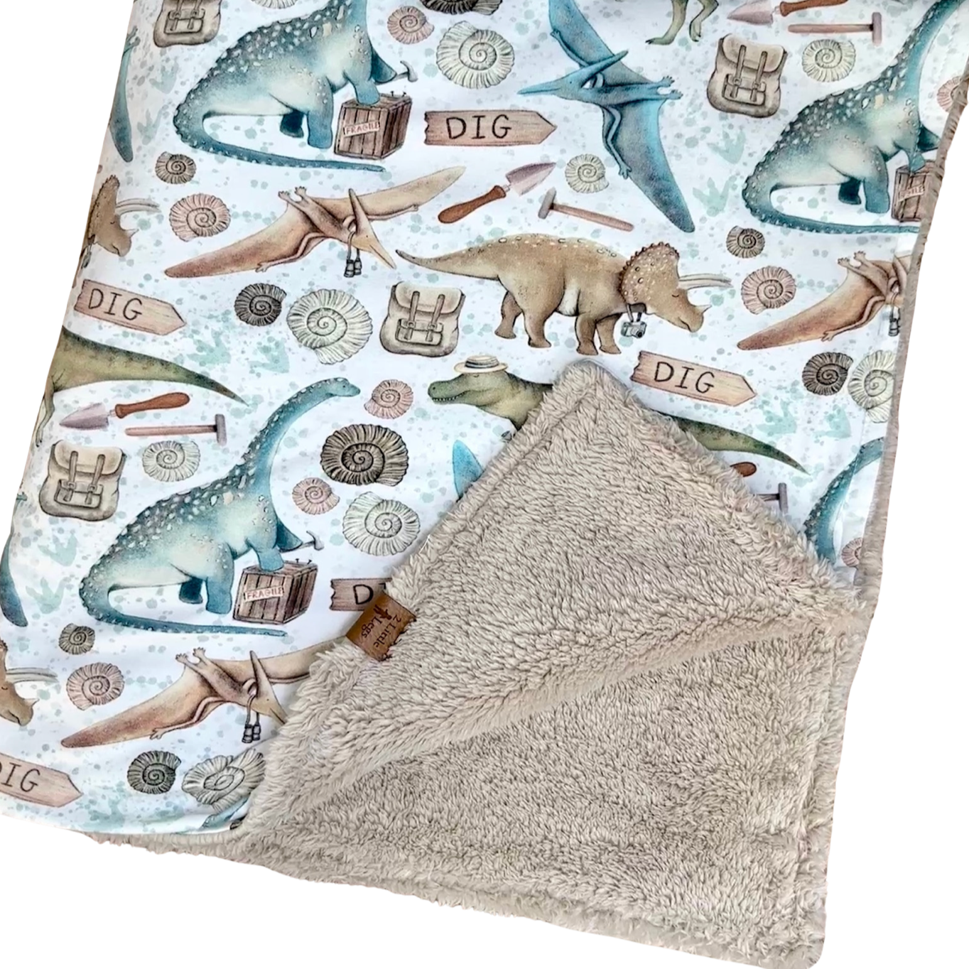 Fleece baby blanket featuring a dinosaur pattern