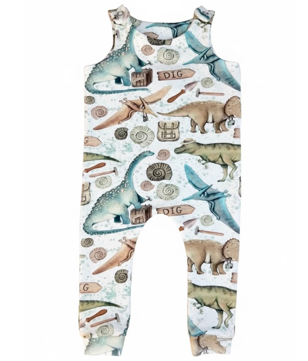 Children's romper with dinosaur themed design on a white background