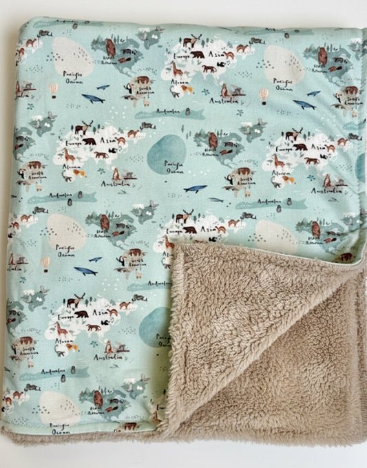 Fleece baby blanket featuring a world map design