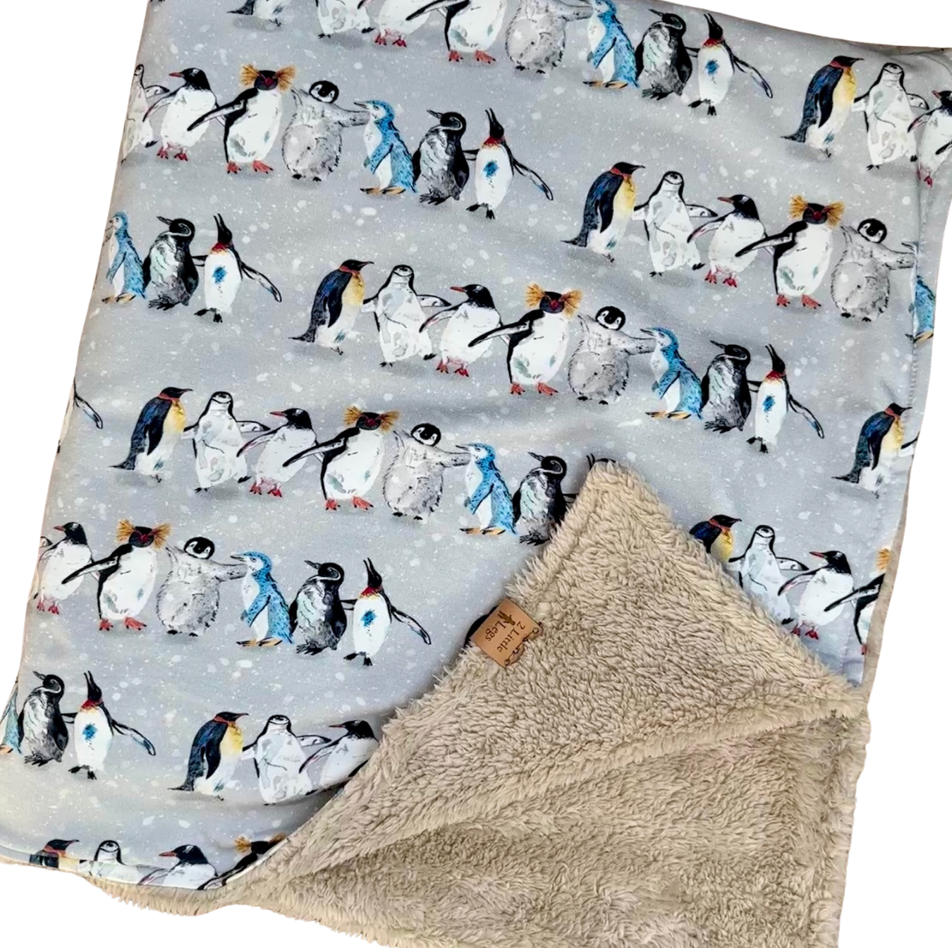 Fleece baby blanket featuring a penguin pattern