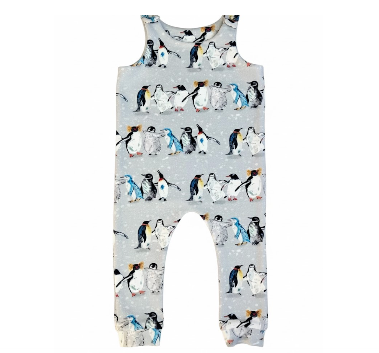 Children's romper with penguin pattern on a light gray background