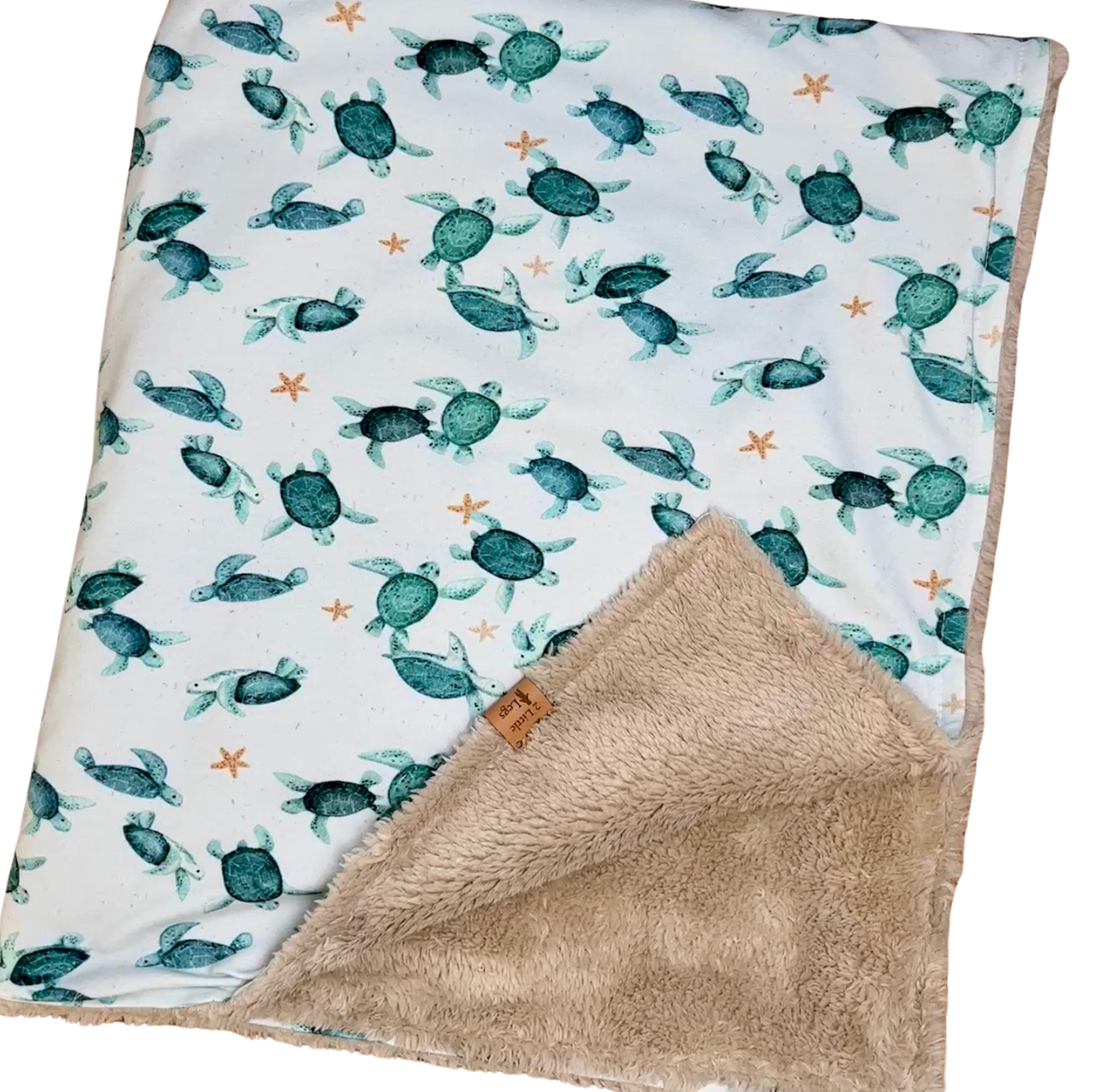 Fleece baby blanket featuring a turtle pattern